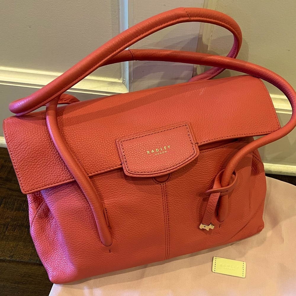 NWOT soft pebbled leather, hard to find color... never used. Dust bag included.